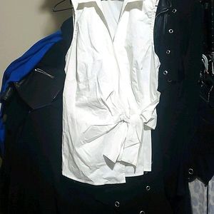 White sleeveless tie front blouse with side zip